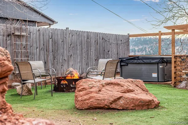a view of a backyard with sitting area