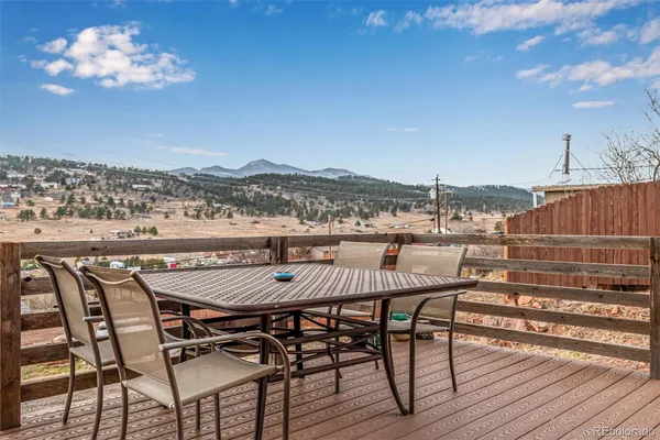 a view of a chairs and table on the terrace