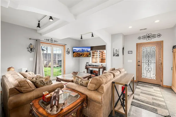 a living room with furniture and a large window