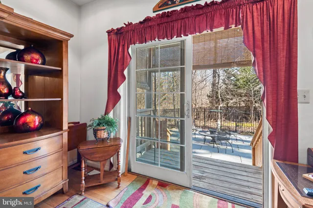 a bed room with a bed and a chair