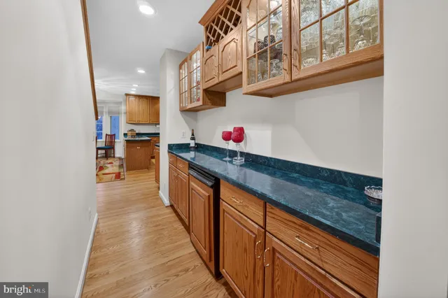 a bedroom with a bed dresser and a window