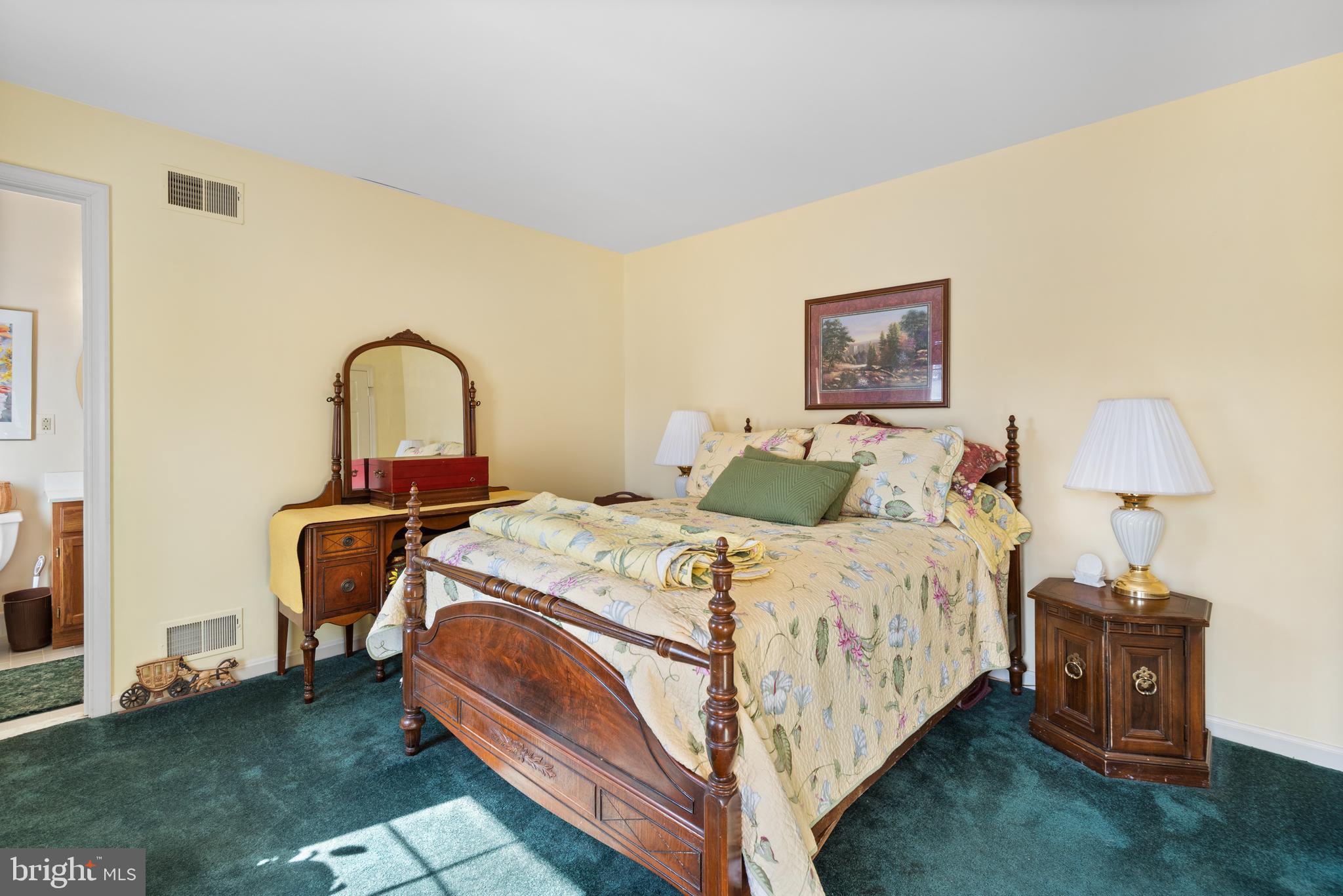 2701 Olney Sandy Spring Road Olney, MD 20832 - Photo 27 of 48 a bed room with a bed and a chair