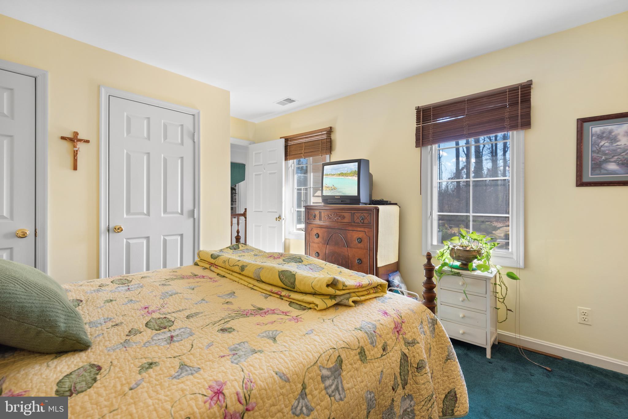 2701 Olney Sandy Spring Road Olney, MD 20832 - Photo 28 of 48 a bedroom with a bed dresser and a window