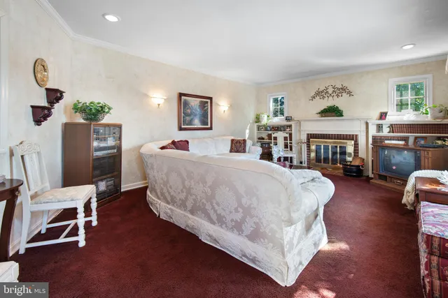 a bathroom with a granite countertop sink mirror vanity and toilet