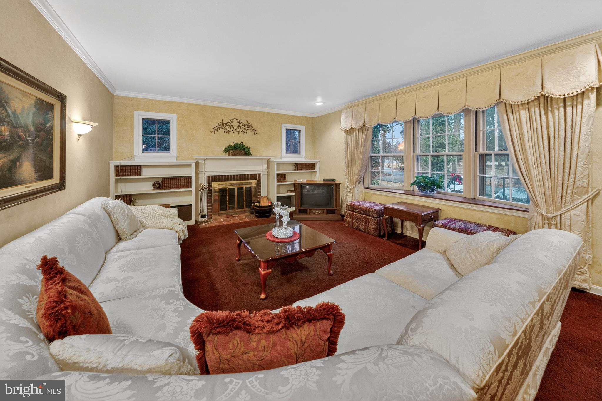2701 Olney Sandy Spring Road Olney, MD 20832 - Photo 6 of 48 a living room with furniture large window and flat screen tv