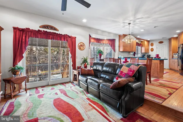 a living room filled with furniture and a rug