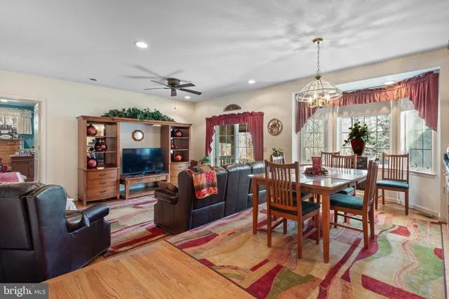 a living room with lots of furniture and a chandelier