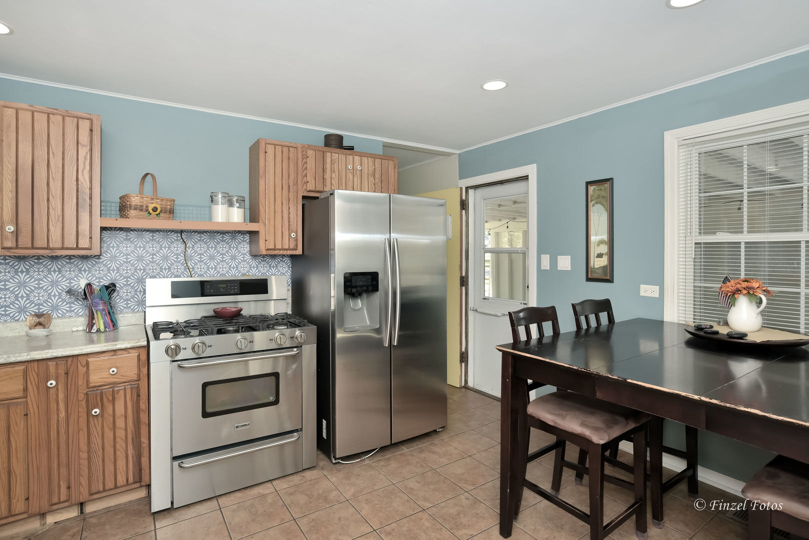 3101 Thrush Lane Rolling Meadows, IL 60008 - Photo 5 of 16 a kitchen with stainless steel appliances granite countertop a stove refrigerator sink and cabinets