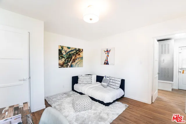 a bathroom with a toilet a sink and a mirror