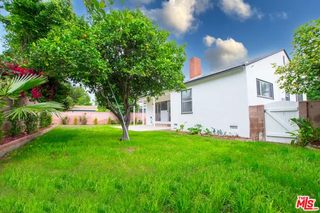 a backyard of a house with lots of green space