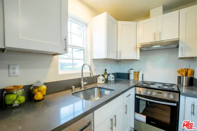 a bedroom with a bed and a chair