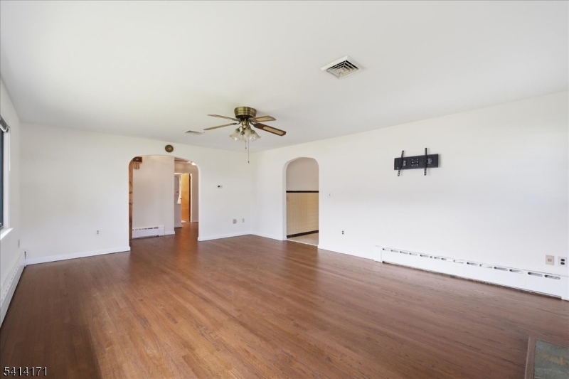 96 Wiltop Road Netcong, NJ 07857 - Photo 2 of 36 an empty room with a window and wooden floor