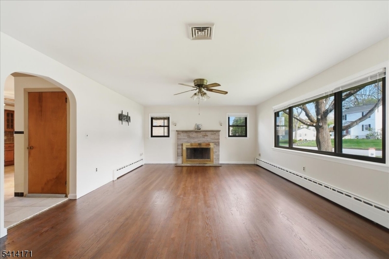 96 Wiltop Road Netcong, NJ 07857 - Photo 3 of 36 an empty room with windows and fireplace