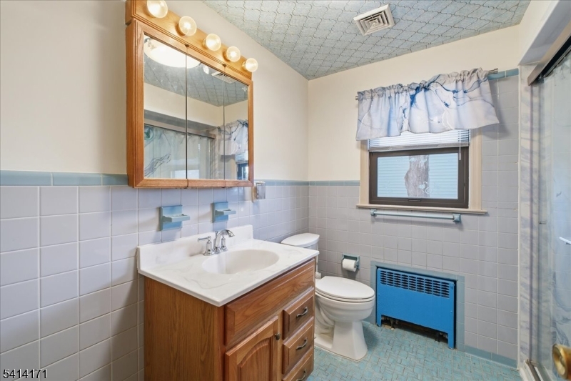 96 Wiltop Road Netcong, NJ 07857 - Photo 36 of 36 a bathroom with a toilet sink and mirror
