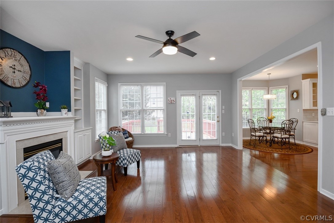 5208 Wheat Ridge Place Glen Allen, VA 23059 - Photo 18 of 45 a living room with furniture a fireplace and wooden floor