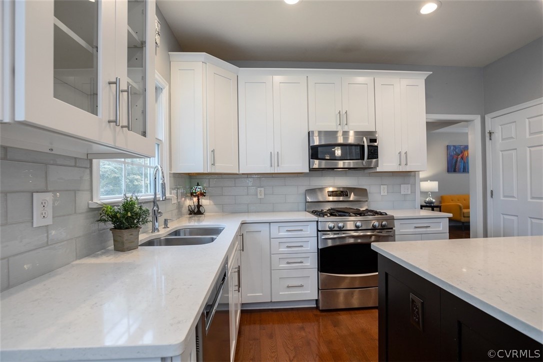 5208 Wheat Ridge Place Glen Allen, VA 23059 - Photo 20 of 45 a kitchen with stainless steel appliances white cabinets and a stove top oven