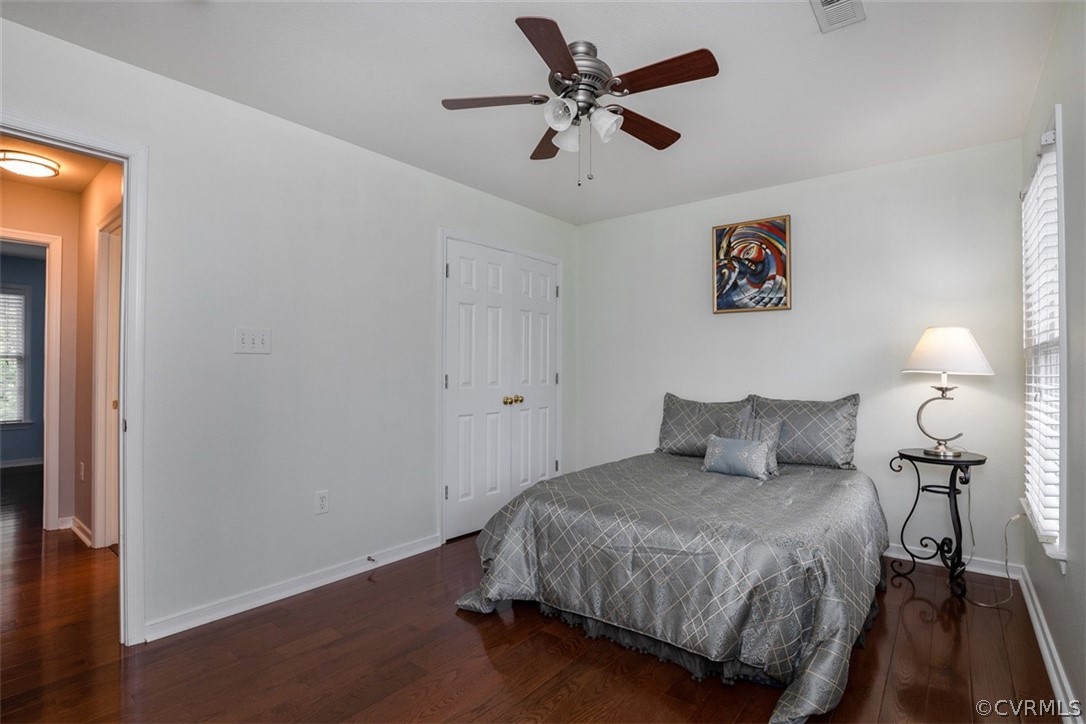 5208 Wheat Ridge Place Glen Allen, VA 23059 - Photo 25 of 45 a bedroom with a bed and a chandelier
