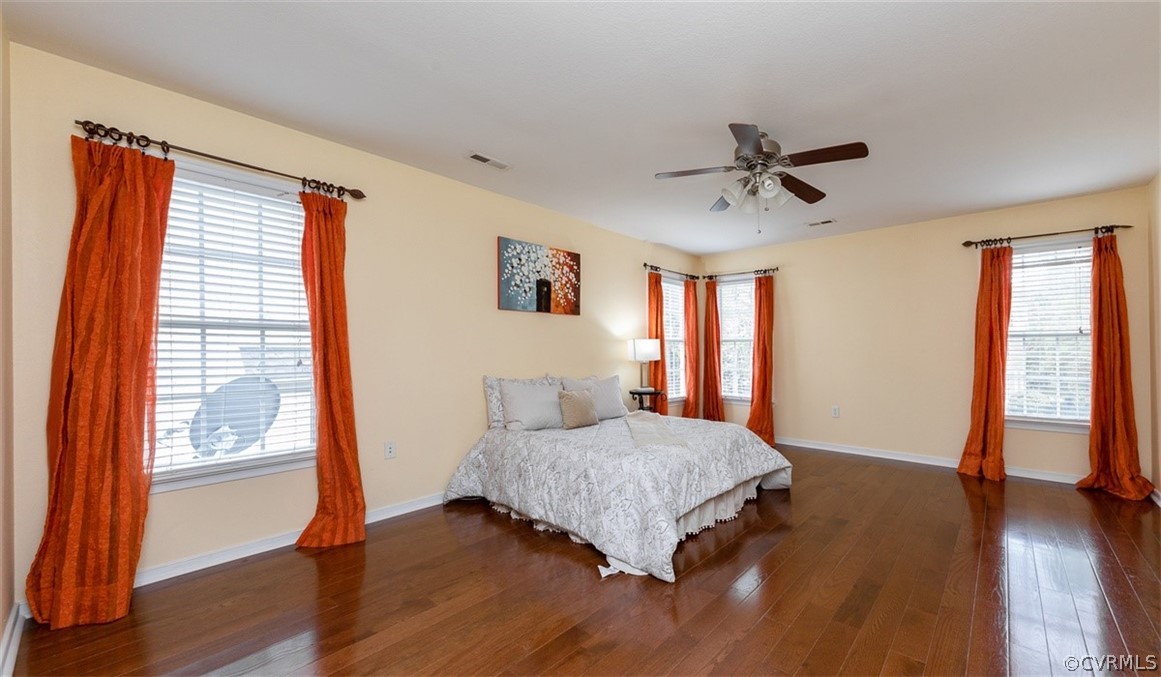 5208 Wheat Ridge Place Glen Allen, VA 23059 - Photo 29 of 45 a living room with a bed furniture and a large window