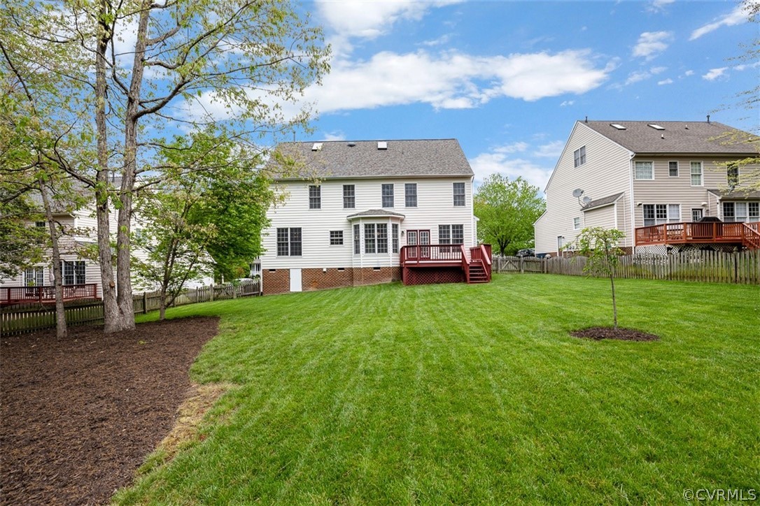 5208 Wheat Ridge Place Glen Allen, VA 23059 - Photo 38 of 45 a front view of a house with a yard table and chairs