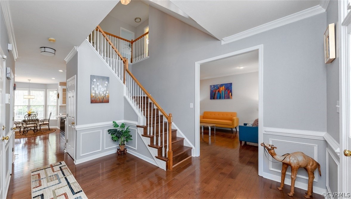 5208 Wheat Ridge Place Glen Allen, VA 23059 - Photo 4 of 45 a view of entryway and hall with wooden floor