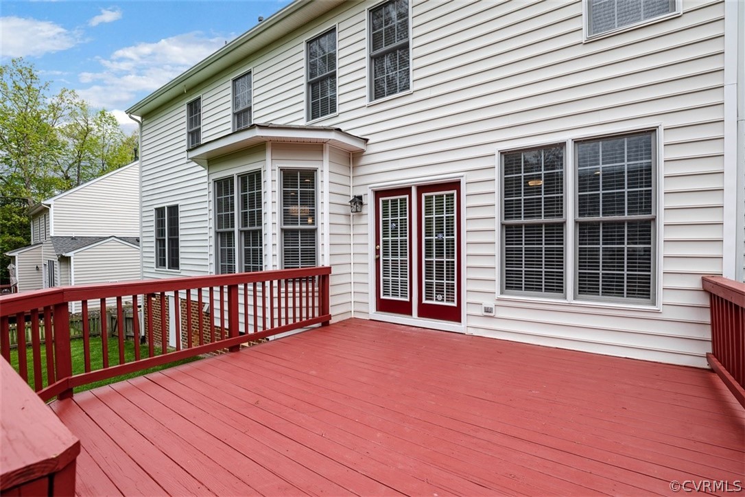 5208 Wheat Ridge Place Glen Allen, VA 23059 - Photo 44 of 45 a view of a deck with a table and chairs