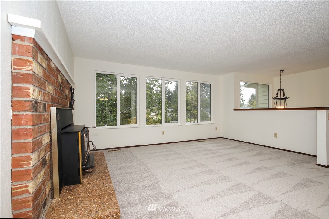 2521 173rd Place Southeast Bothell, WA 98012 - Photo 2 of 21 a view of an empty room with a window