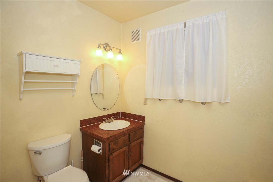 2521 173rd Place Southeast Bothell, WA 98012 - Photo 16 of 21 a bathroom with a sink toilet and a mirror