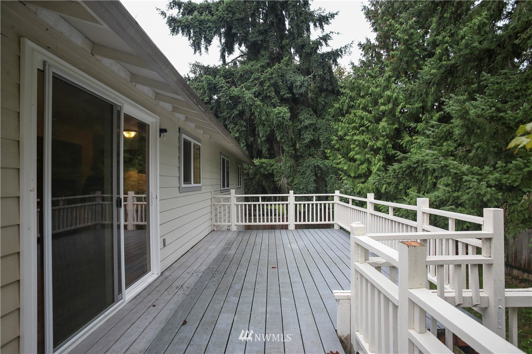 2521 173rd Place Southeast Bothell, WA 98012 - Photo 17 of 21 a view of a balcony with wooden floor and fence