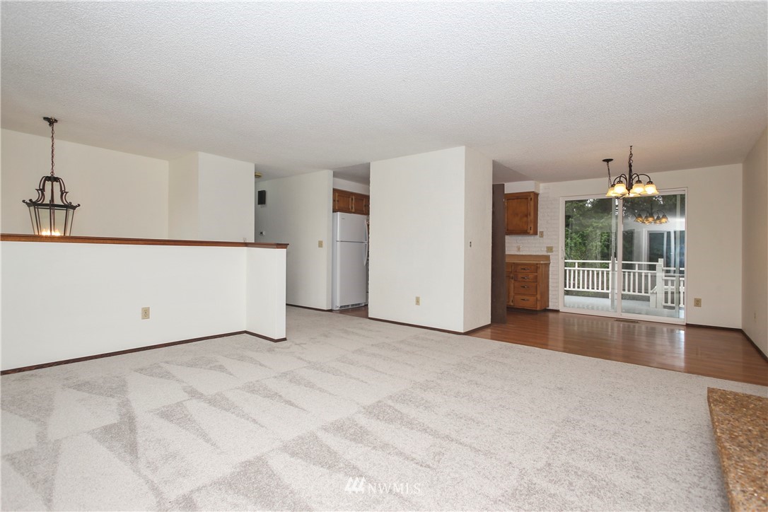 2521 173rd Place Southeast Bothell, WA 98012 - Photo 3 of 21 a view of an empty room with a window