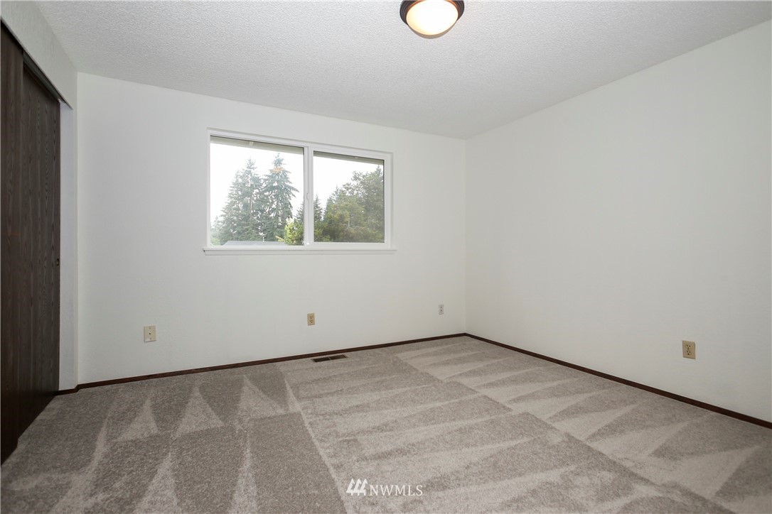 2521 173rd Place Southeast Bothell, WA 98012 - Photo 10 of 21 an empty room with a window