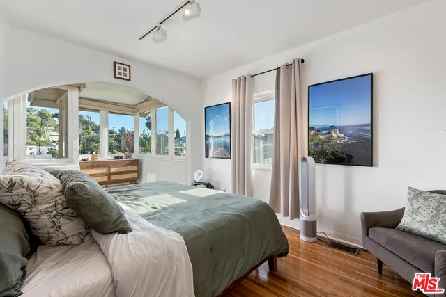 a living room with furniture and windows