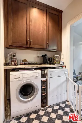 a bedroom with bed and flat screen tv