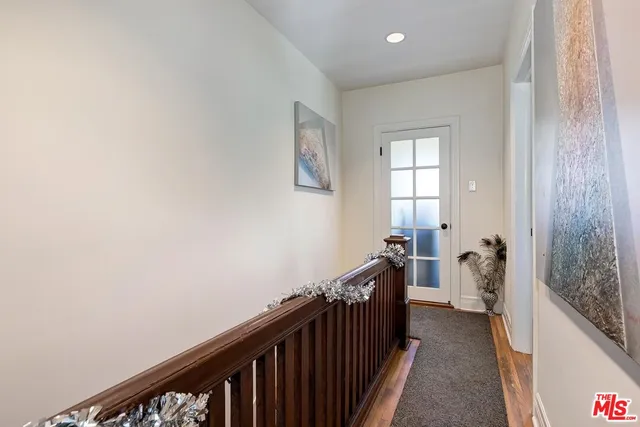 a bedroom with a bed chair and a window