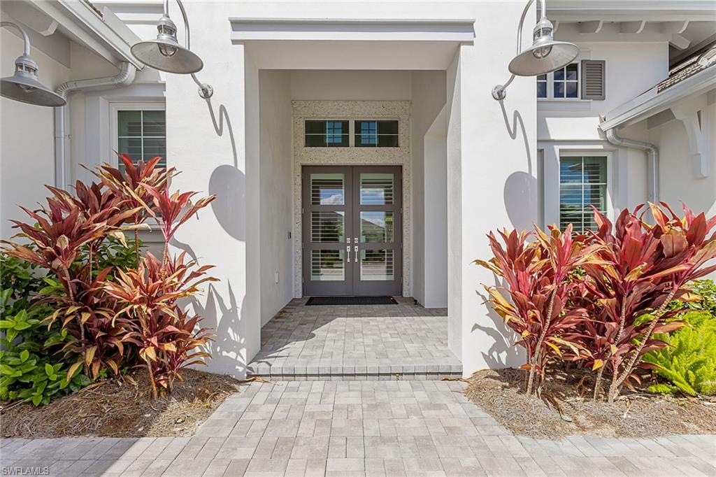 8829 Paradera Court Naples, FL 34112 - Photo 3 of 31 a front view of a house with garden