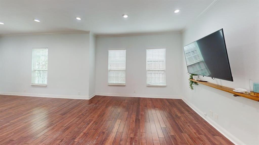 4523 Sycamore Street Dallas, TX 75204 - Photo 5 of 16 Spacious interior featuring wood-finish flooring, recessed lighting, and crisp white walls
