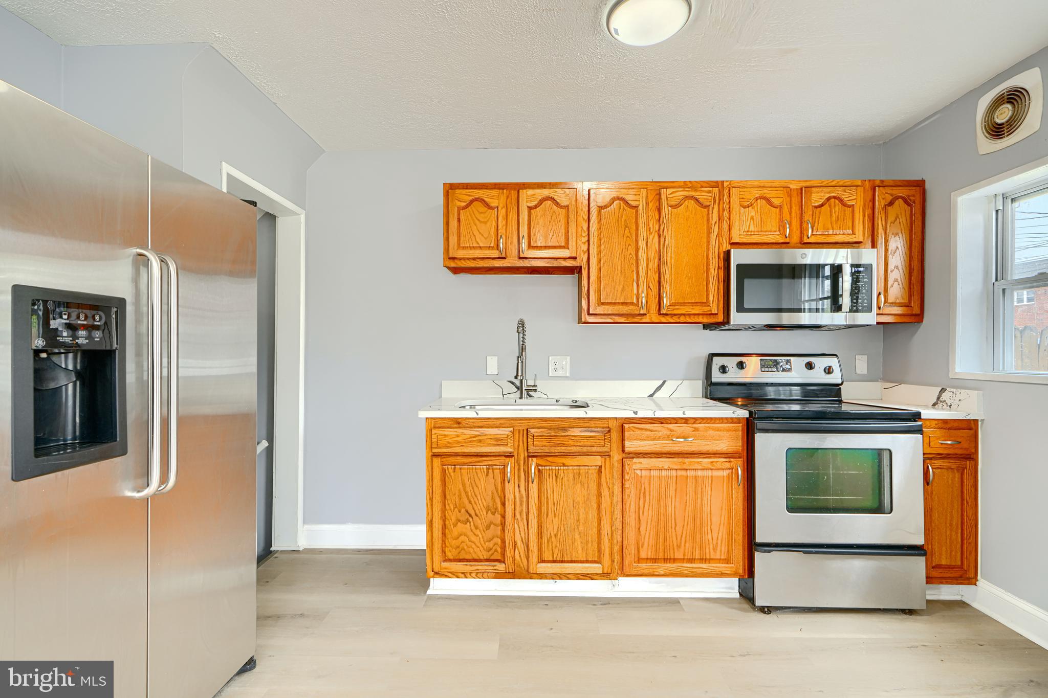 1902 Kelmore Road Baltimore, MD 21222 - Photo 8 of 27 KITCHEN w/ STAINLESS APPLIANCES