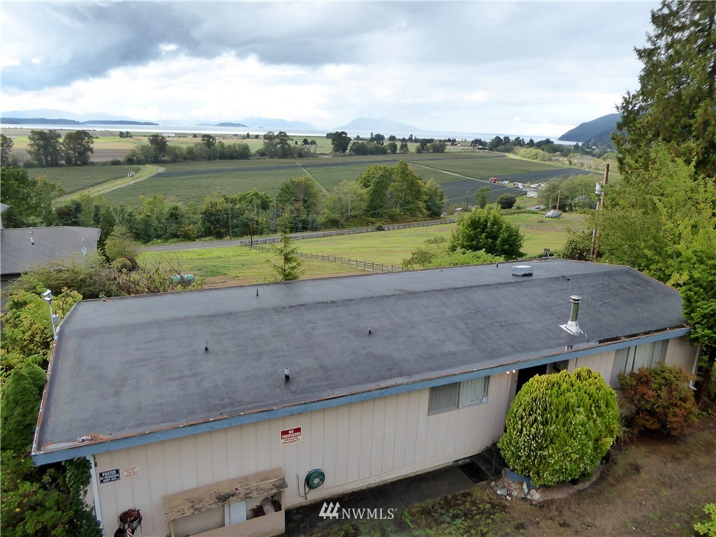 16084 Tulip Lane Bow, WA 98232 - Photo 3 of 8 an aerial view of a house with a yard and plants