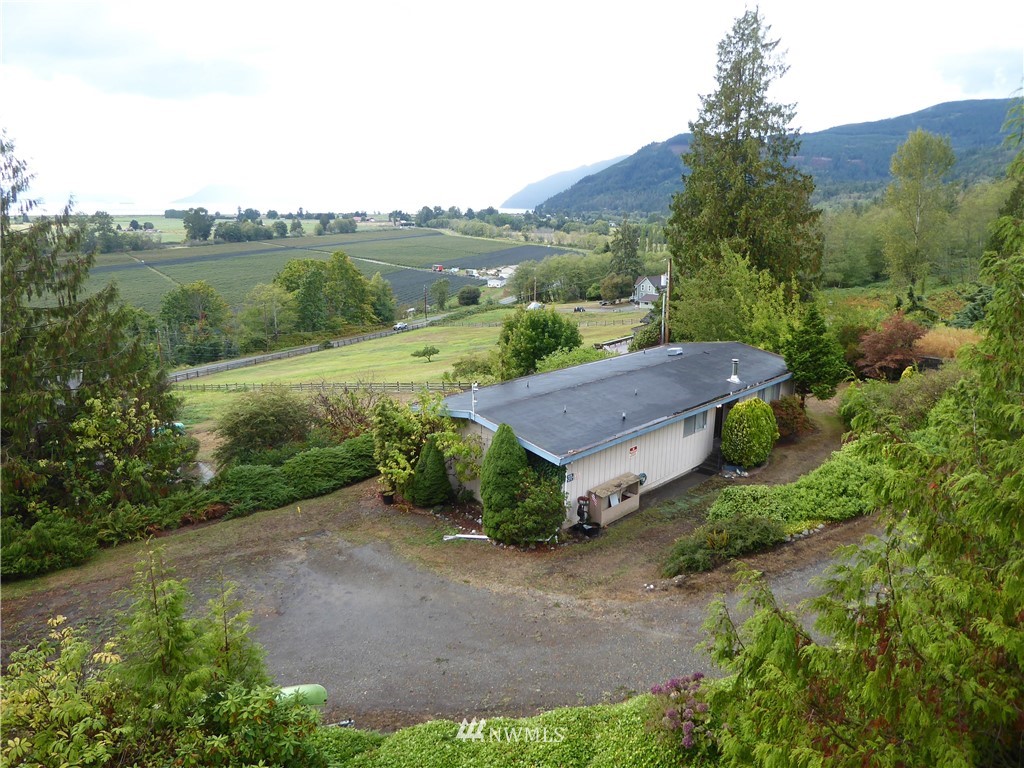 16084 Tulip Lane Bow, WA 98232 - Photo 7 of 8 an aerial view of a house with mountain view