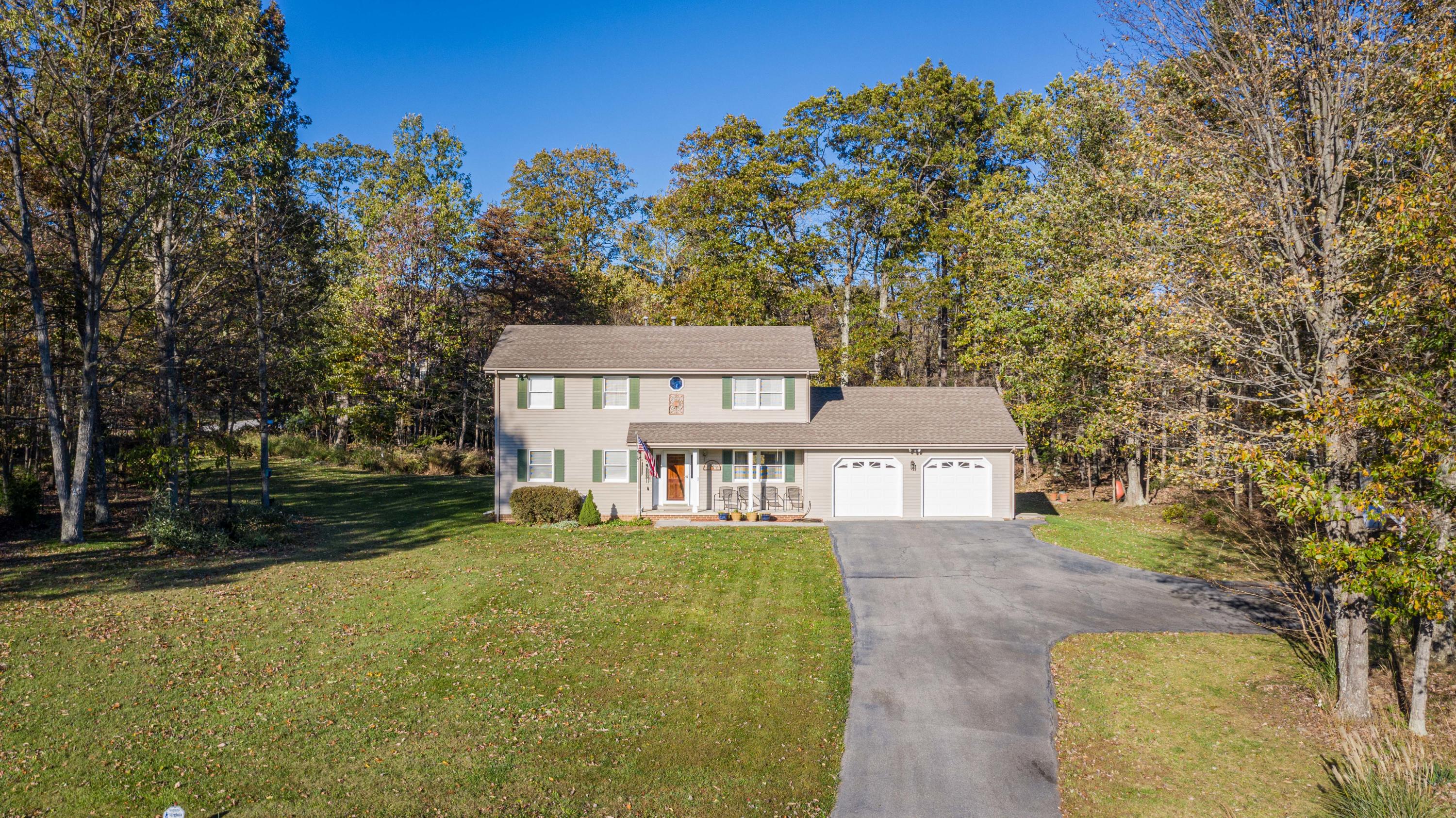 218 Oak Ridge Court Blue Ridge, VA 24064 - Photo 1 of 48 a view of a house with a yard