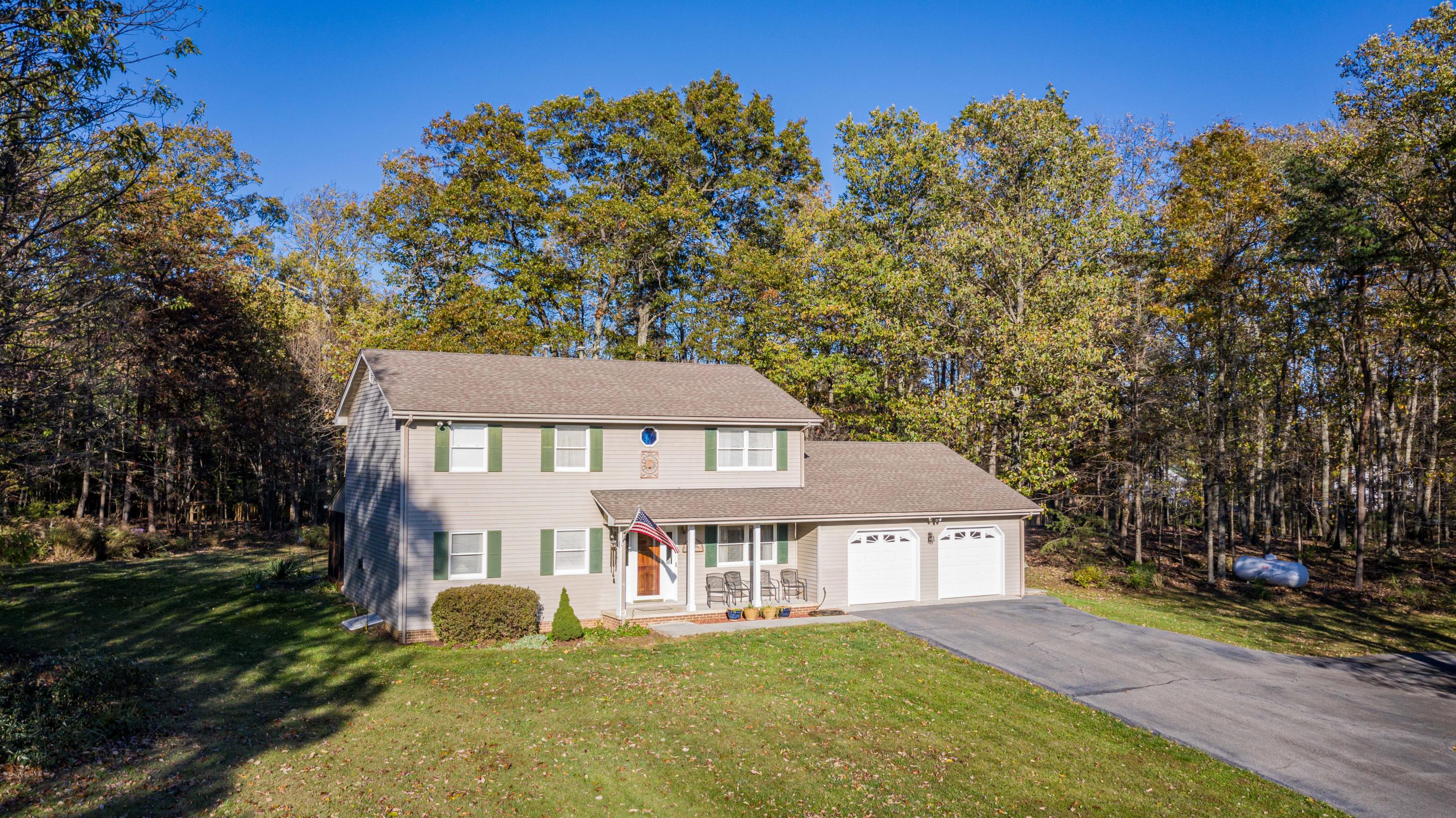 218 Oak Ridge Court Blue Ridge, VA 24064 - Photo 2 of 48 front view of a house with a yard