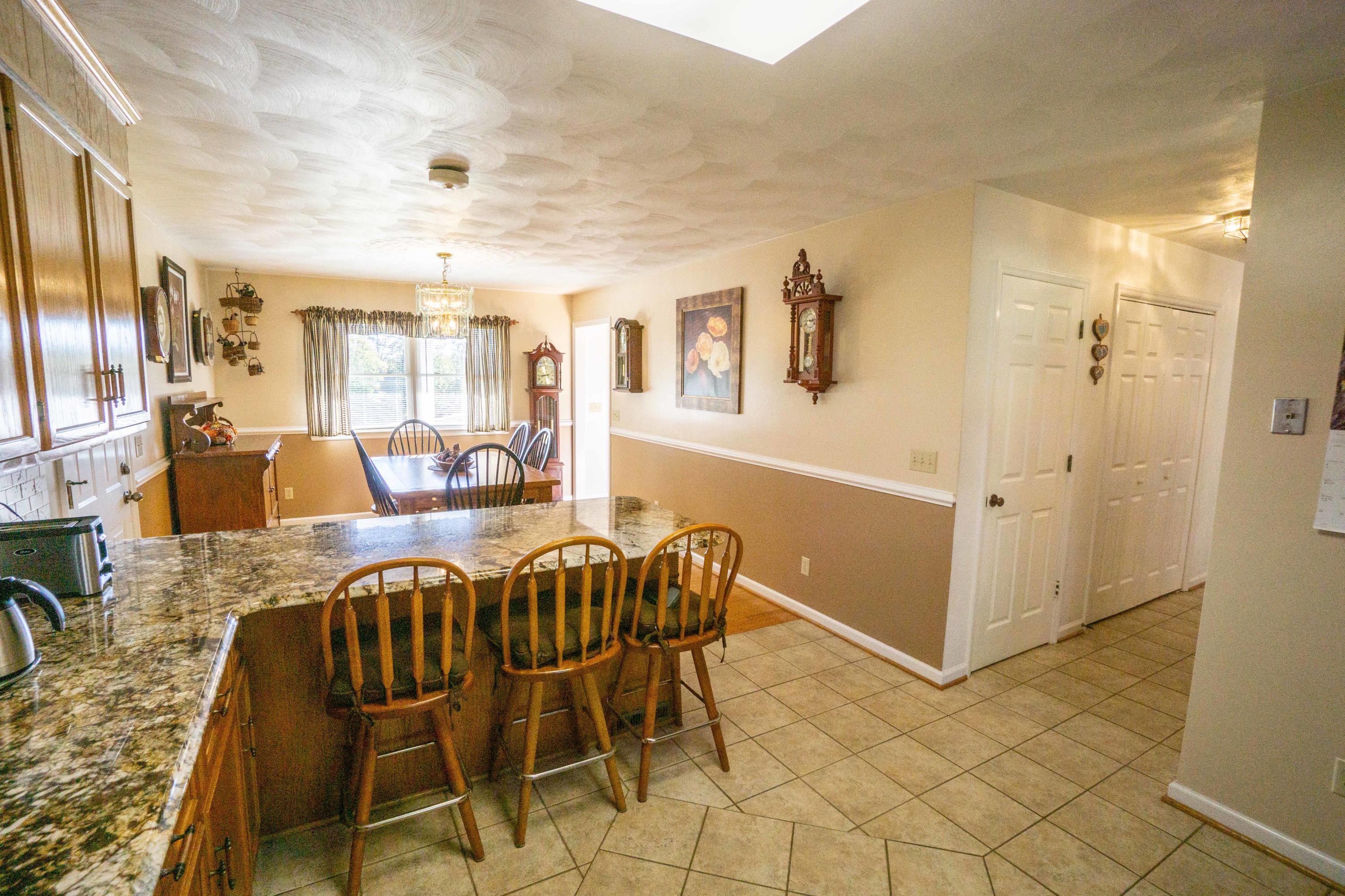 218 Oak Ridge Court Blue Ridge, VA 24064 - Photo 15 of 48 a view of a dining room with furniture