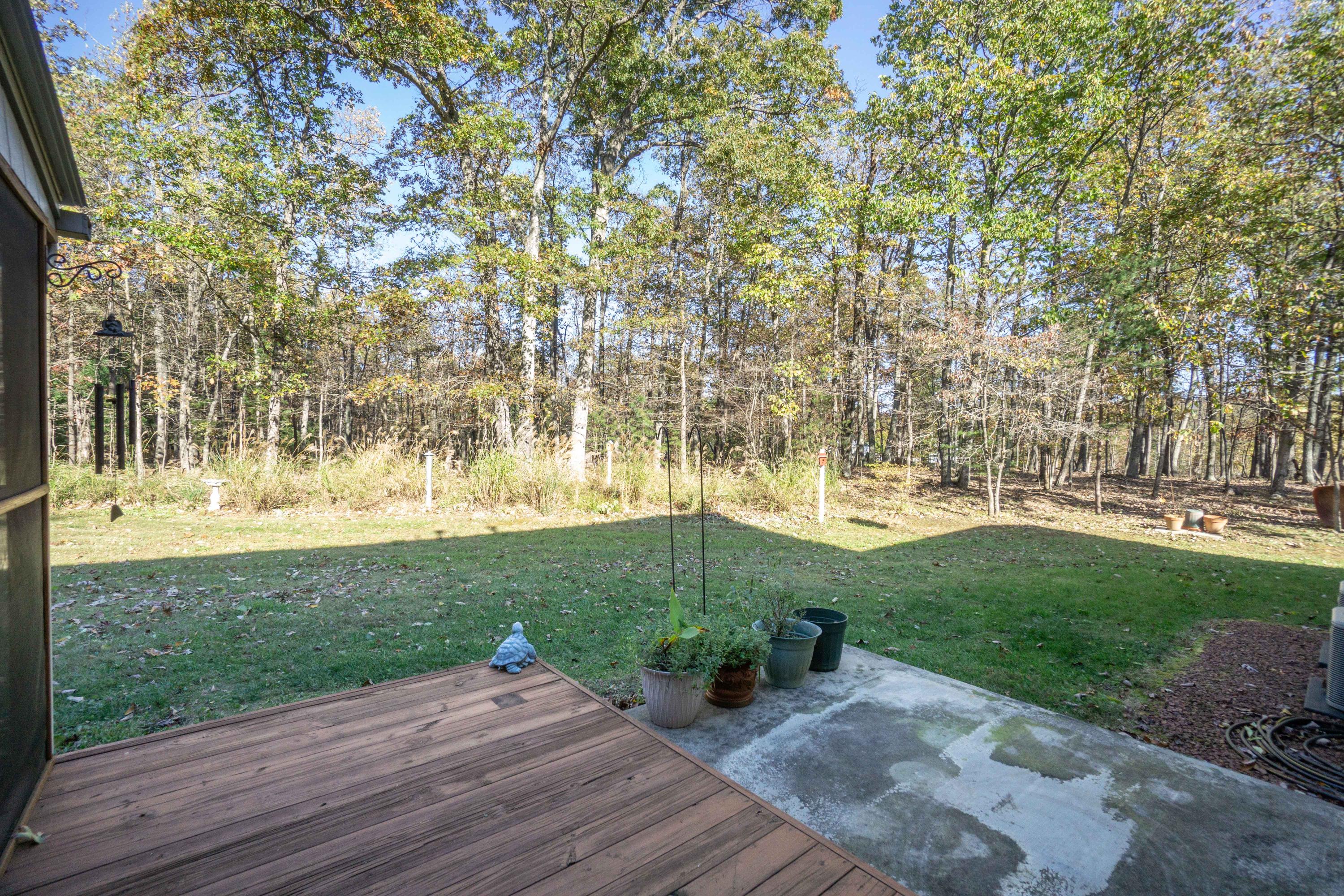 218 Oak Ridge Court Blue Ridge, VA 24064 - Photo 22 of 48 a wooden bench sitting in the middle of a yard