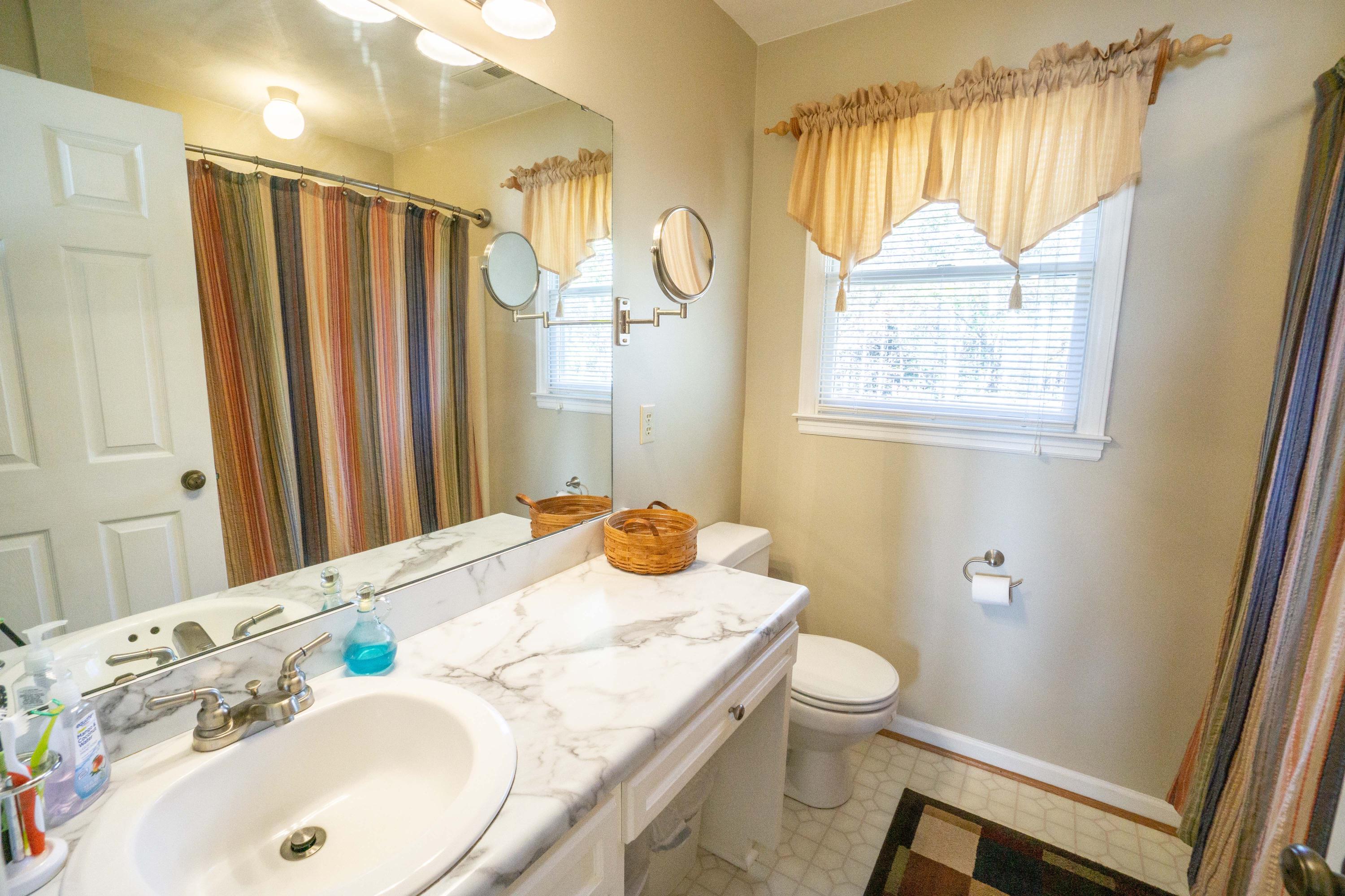 218 Oak Ridge Court Blue Ridge, VA 24064 - Photo 27 of 48 a bathroom with a granite countertop sink toilet and shower