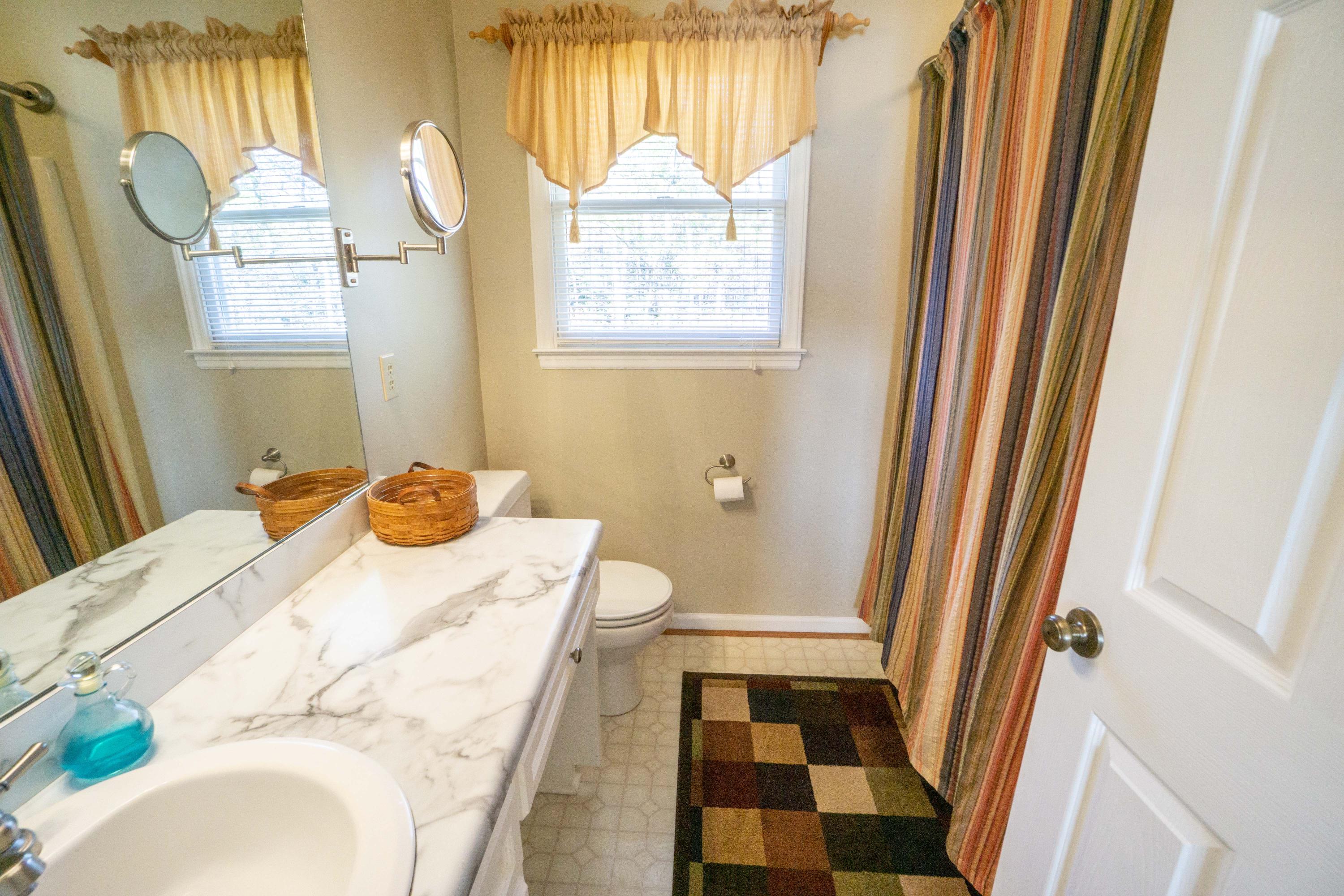 218 Oak Ridge Court Blue Ridge, VA 24064 - Photo 28 of 48 a bathroom with a sink and a mirror