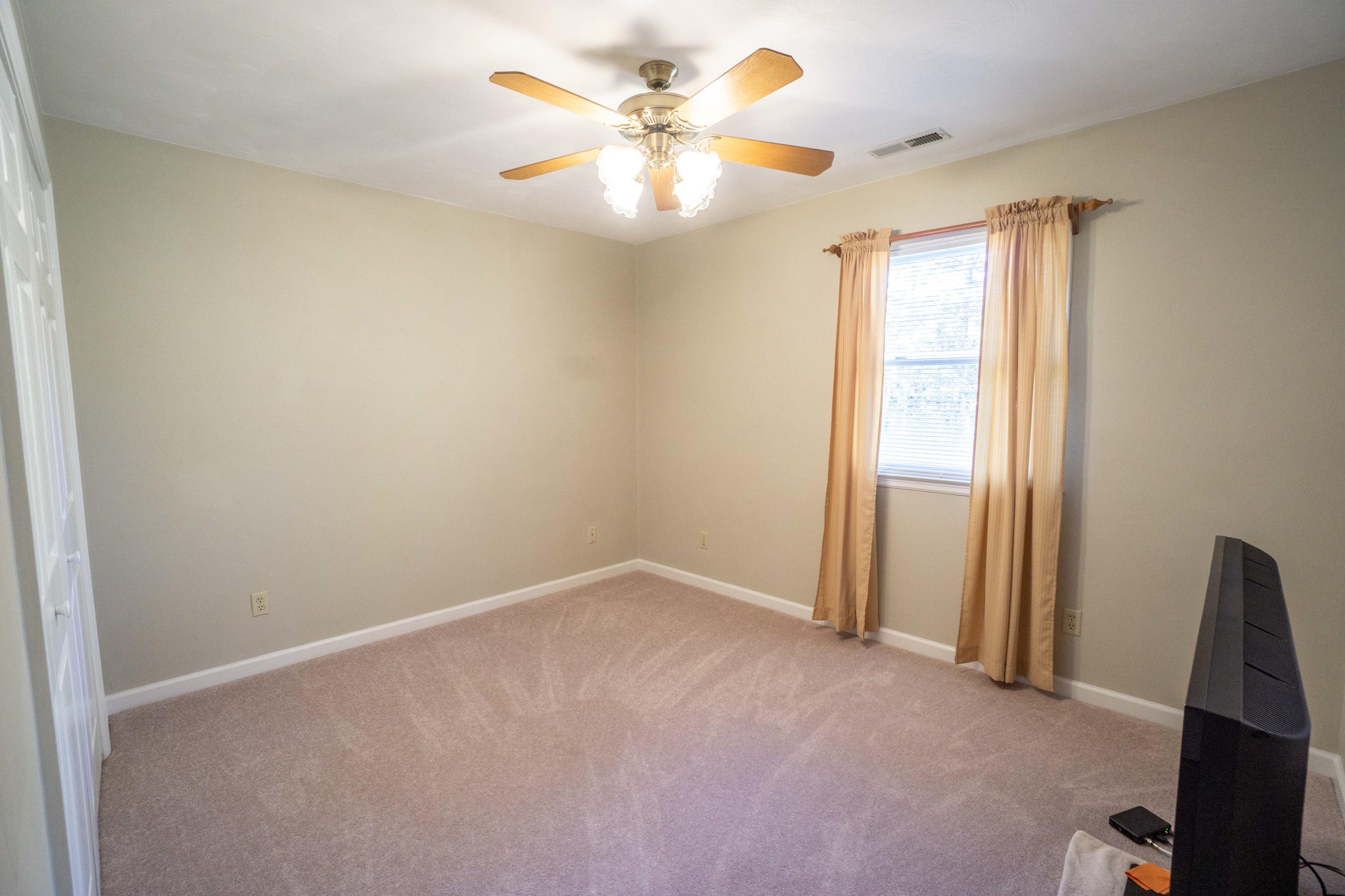 218 Oak Ridge Court Blue Ridge, VA 24064 - Photo 30 of 48 an empty room with windows and fan