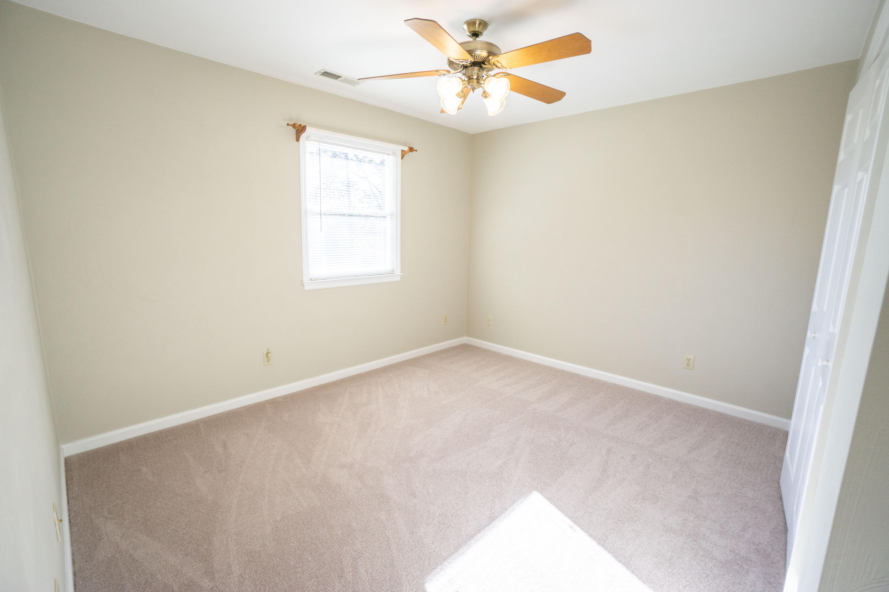 218 Oak Ridge Court Blue Ridge, VA 24064 - Photo 32 of 48 an empty room with a window and a fan