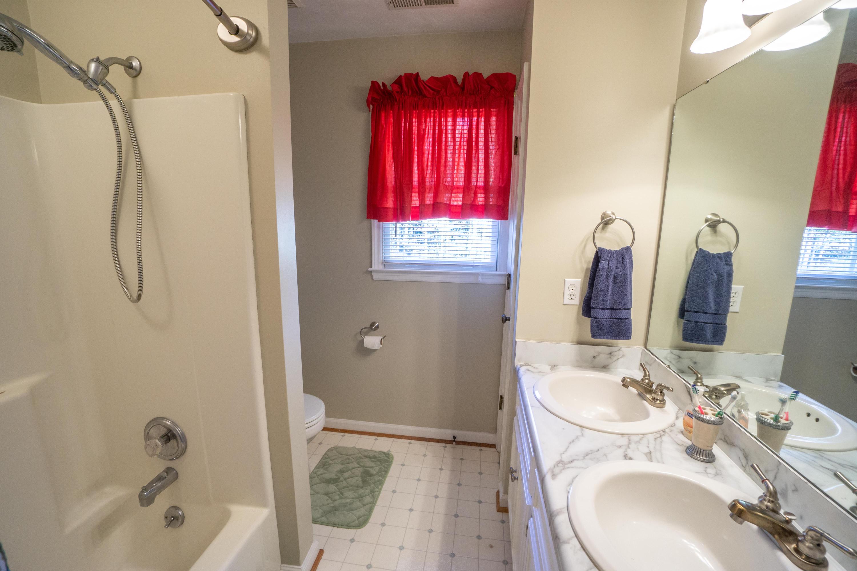 218 Oak Ridge Court Blue Ridge, VA 24064 - Photo 34 of 48 a bathroom with a sink vanity tub and shower