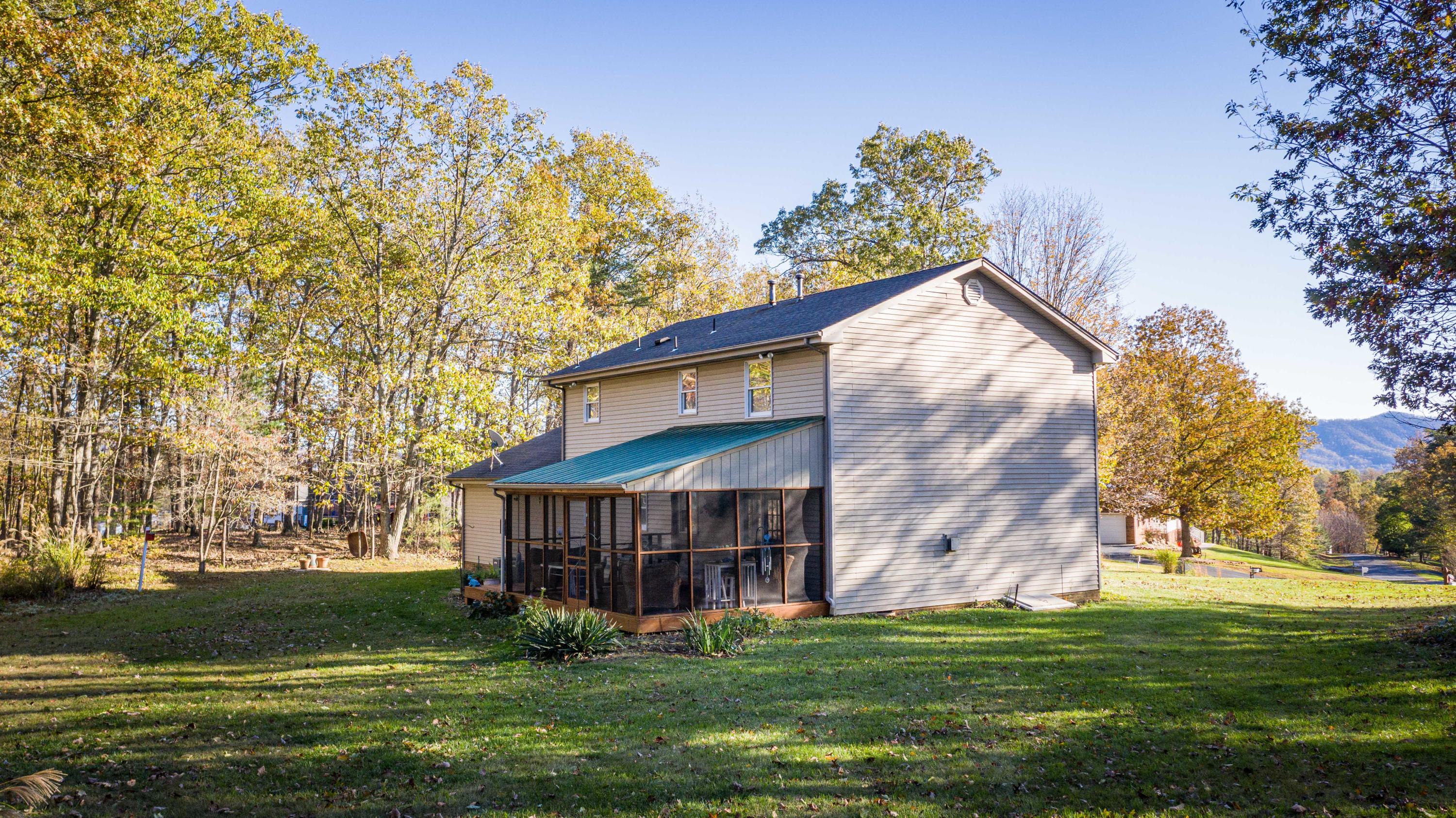 218 Oak Ridge Court Blue Ridge, VA 24064 - Photo 42 of 48 a view of a house with a yard