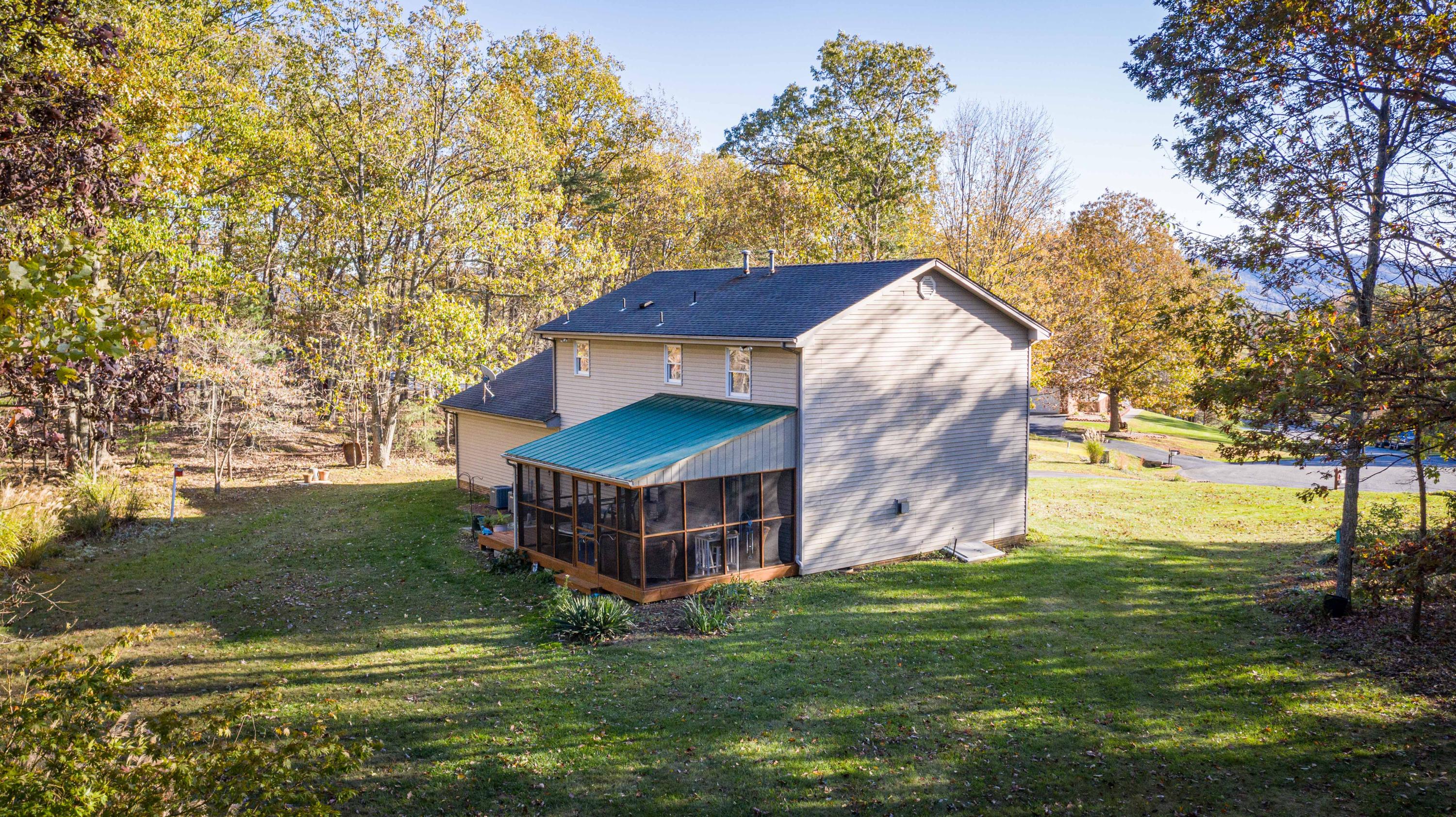 218 Oak Ridge Court Blue Ridge, VA 24064 - Photo 44 of 48 a view of a house with a yard