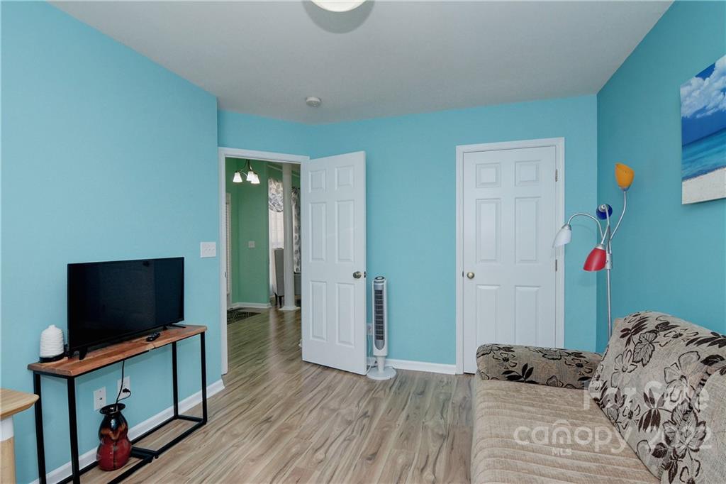 1421 Autumn Ridge Lane Fort Mill, SC 29708 - Photo 23 of 48 a bedroom with a bed and a flat screen tv